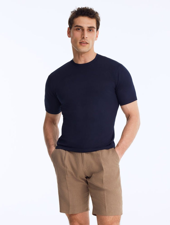 Front View: Model Wearing Men's Atlas Dark Blue T-Shirt - Crew Neck, Slim Fit, Woven Cotton, Short-Sleeved, MOEVA Luxury Swimwear