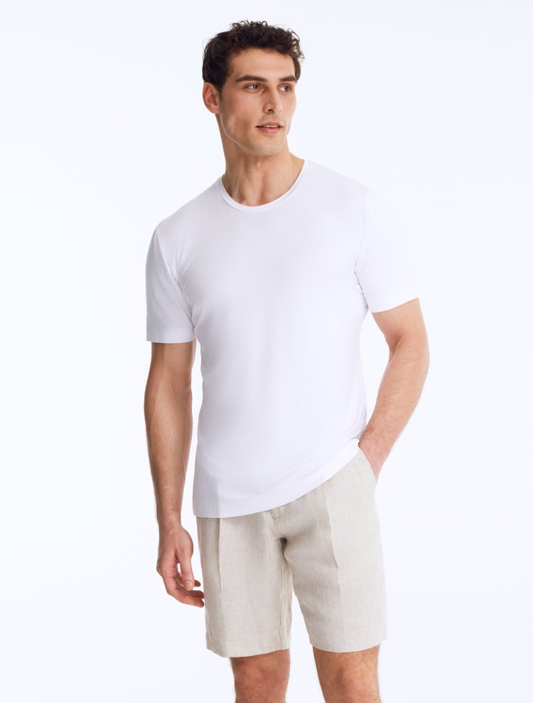 Front View: Model Wearing Men's Atlas White T-Shirt - Crew Neck, Slim Fit, Woven Cotton, Short-Sleeved - MOEVA Luxury Swimwear