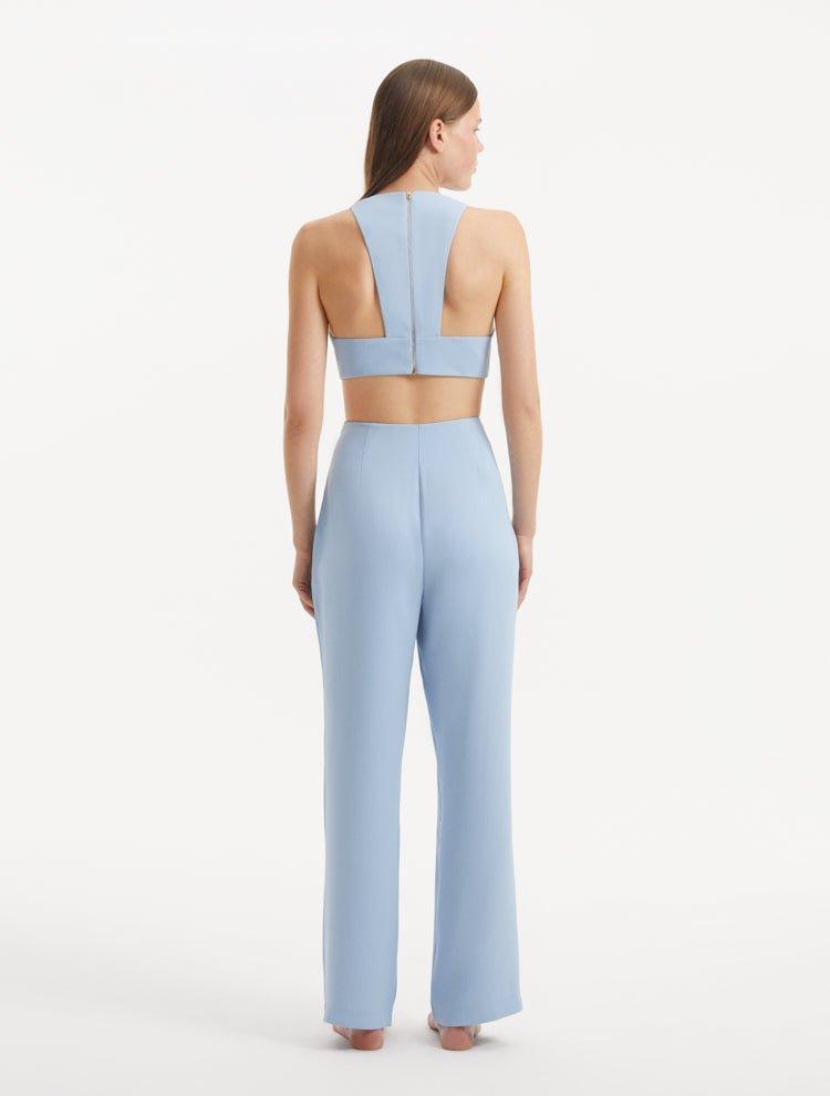 "Back view of the Augustine White Baby Blue Top and Wade Pants, displaying the contemporary cropped silhouette and stylish design."