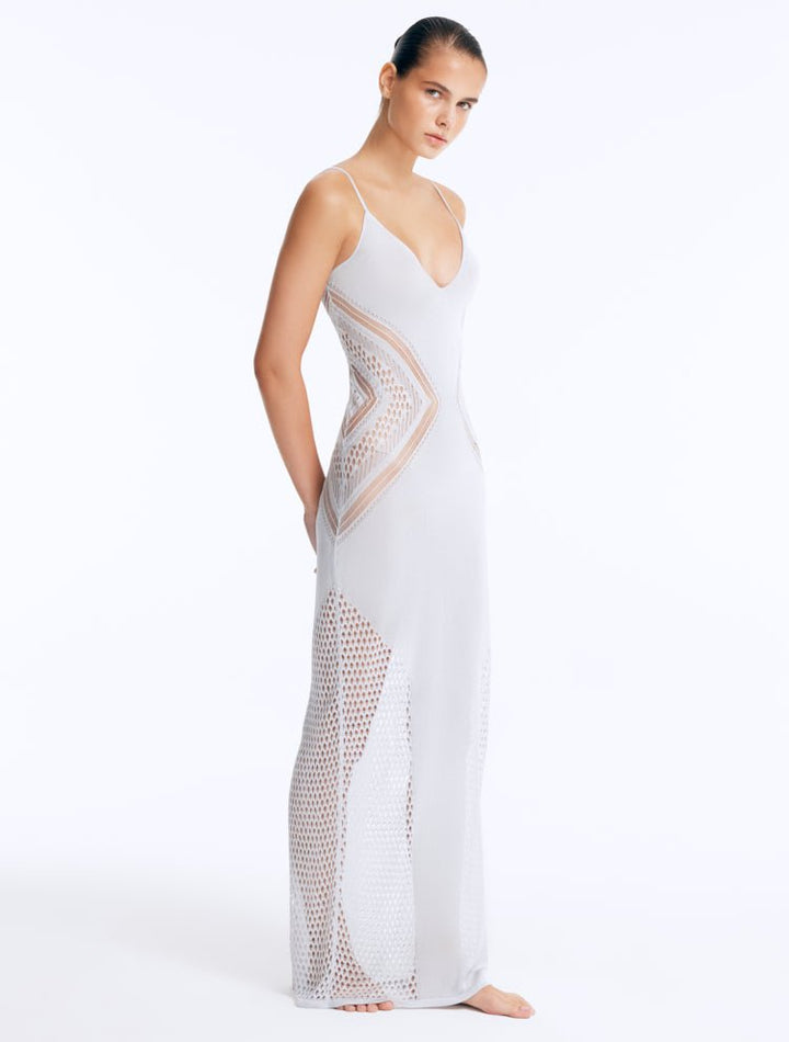 Side View: Model in Azalea Silver Dress - Chic Maxi Dress, Knitted, Ankle Length, V Neckline, %100 Viscose, MOEVA Luxury Swimwear