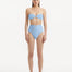 "Front view of Baia baby blue high-waist bikini bottom featuring shell-shaped gold buttons and luxurious Italian fabric."