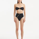 Baia Black Bikini Bottom front view, showcasing high-waist design and gold shell buttons.