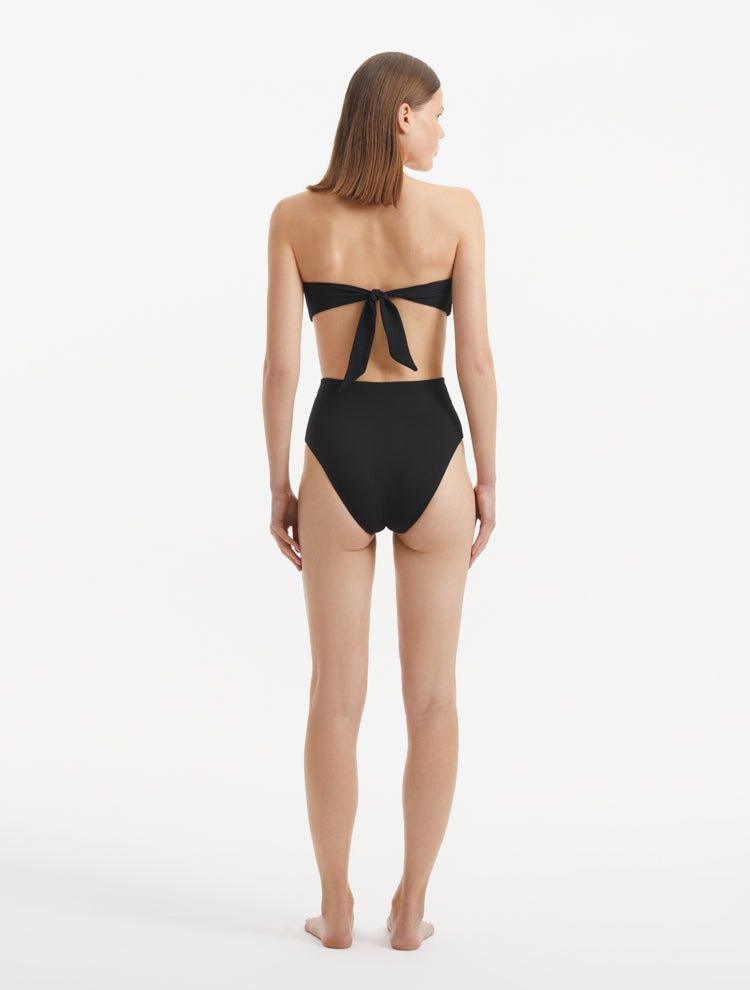 Baia Black Bikini Bottom front view, showcasing high-waist design and gold shell buttons.