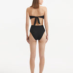 Baia Black Bikini Bottom front view, showcasing high-waist design and gold shell buttons.