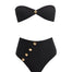 Model showcasing the Baia Black Bikini Set from the front, highlighting the strapless bandeau top with gold shell buttons and the sleek, minimalist bikini bottom with gold detailing.