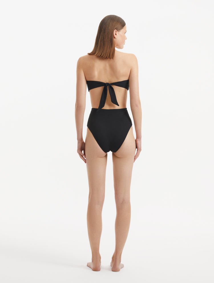 Back view of Baia Black Bikini Top, showcasing gold clasp and sleek fit.