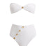 A detailed decoupage image of the Baia White Bikini Set, showcasing the strapless bandeau top with gold shell buttons, the sleek bikini bottom, and the luxe gold clasps, capturing the essence of elegance and high-end design.