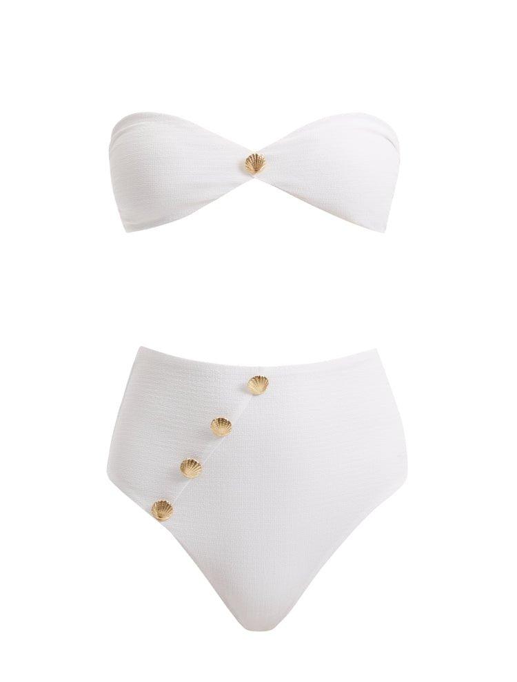 A detailed decoupage image of the Baia White Bikini Set, showcasing the strapless bandeau top with gold shell buttons, the sleek bikini bottom, and the luxe gold clasps, capturing the essence of elegance and high-end design.