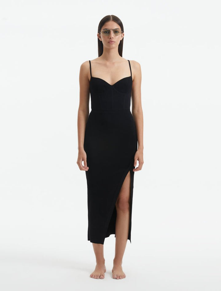 Front View: Model in Beau Black Dress - MOEVA Luxury Swimwear, Knitted, Ankle Length, Close Fit, Stitching Details, Decorative Ribbed Details, Scoop Neck, MOEVA Luxury Swimwear