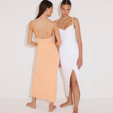 Front View: Model in Beau White Dress - MOEVA Luxury Swimwear, Sleeveless Knitted Maxi Dress, Ankle Length, Close Fit, Scoop Neck, MOEVA Luxury Swimwear