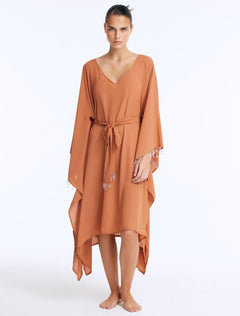Front View: Model wearing Bethany Bronze Kaftan - Long Soft Touch Kaftan, Knee Length, V Neckline, Embellished with Clear Glass Beads, MOEVA Luxury Beachwear