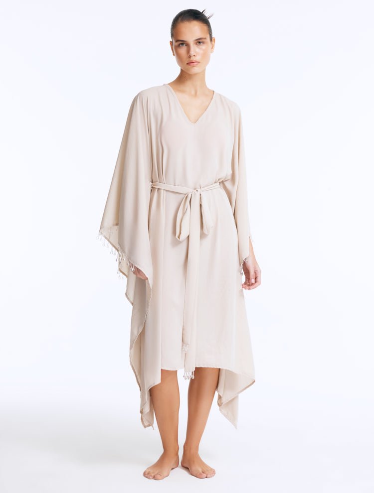 Front View: Model wearing Bethany Silver Kaftan - Long Soft Touch Kaftan, Knee Length, V Neckline, Embellished with Clear Glass Beads, MOEVA Luxury Beachwear