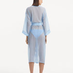 Back view of the Blaze baby blue kaftan, showing the ankle-length design and self-tie belt that creates a graceful drape while emphasizing the waistline.