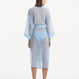 Back view of the Blaze baby blue kaftan, showing the ankle-length design and self-tie belt that creates a graceful drape while emphasizing the waistline.