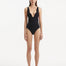 Front view of Breena Black Swimsuit, showcasing textured wave detail and elegant V-neck design.