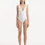 Front view of Breena White Swimsuit, showcasing wavy textured detail and V-neck design.