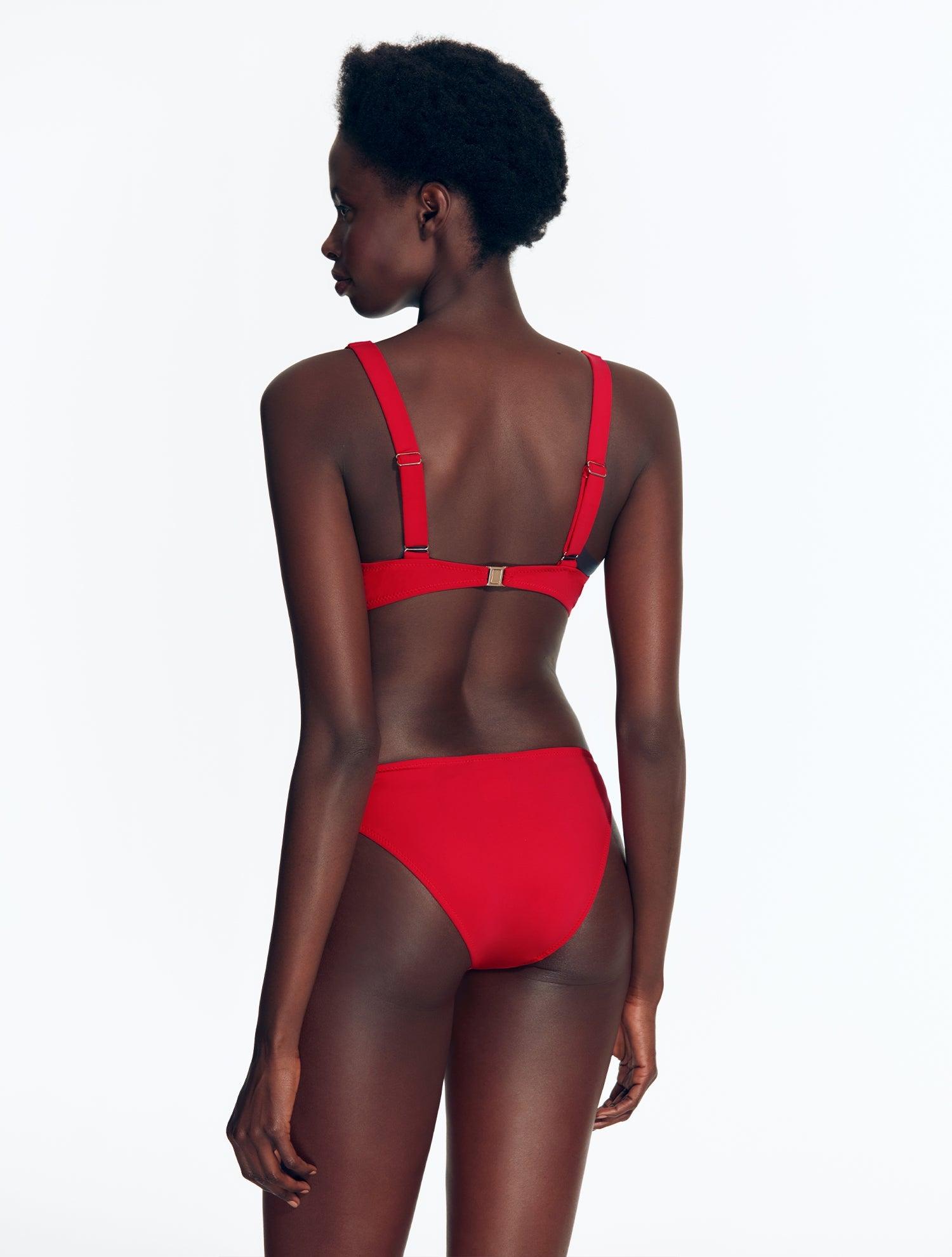 "Back view of the Brenda Bikini Top with chic design and button accents on a model."