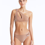 Front View: Model in Calix Bronze Bikini Set - One Shoulder, Fully Lined, Chic, Metallic Fabric, Clear Glass Hoop Accessory Detail, MOEVA Luxury Swimwear