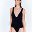 "Front view of the Carina Shiny Black Swimsuit highlighting the V-neckline and ruched band under the bust."