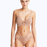 Front View: Model in Cassia Bronze Bikini Set- Scoop Neck, Metallic Fabric, Clear Glass Drop Shaped Accessory, Topstitching Details, Gold Clasps, MOEVA Luxury Swimwear