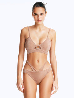 Front View: Model in Cassia Bronze Bikini Set- Scoop Neck, Metallic Fabric, Clear Glass Drop Shaped Accessory, Topstitching Details, Gold Clasps, MOEVA Luxury Swimwear