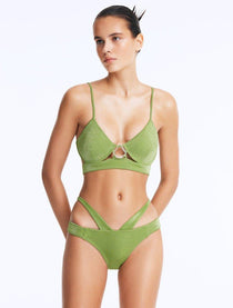 Front View: Model Wearing Cassia Green Bikini Bottom - Low Waist Briefs, Chic and Accessorized, Metallic Fabric, MOEVA Luxury Swimwear
