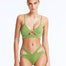 Front View: Model in Cassia Green Bikini Top - Scoop Neck, Metallic Fabric, Clear Glass Drop Shaped Accessory, Topstitching Details, Gold Clasps, MOEVA Luxury Swimwear