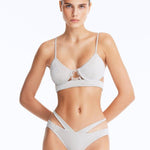 Front View: Model Wearing Cassia Silver Bikini Set- Low Waist Briefs, Chic and Accessorized, Metallic Fabric, MOEVA Luxury Swimwear