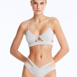Front View: Model Wearing Cassia Silver Bikini Set- Low Waist Briefs, Chic and Accessorized, Metallic Fabric, MOEVA Luxury Swimwear