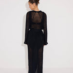 Back View: Model in Chad Black Kaftan - MOEVA Luxury Swimwear, Knitted Ankle Length Beach Kaftan, Self-Tie Belt, Loose Fit, MOEVA Luxury Swimwear