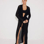 Front View: Model in Chad Black Kaftan - MOEVA Luxury Swimwear, Mesh Knit, Long-Sleeved, Ankle Length, MOEVA Luxury Swimwear