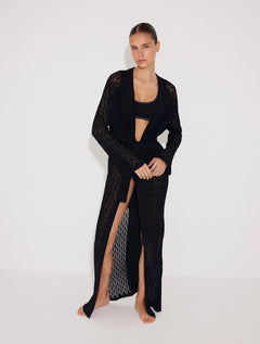 Front View: Model in Chad Black Kaftan - MOEVA Luxury Swimwear, Mesh Knit, Long-Sleeved, Ankle Length, MOEVA Luxury Swimwear