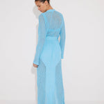 "Back view of the Chad Kaftan on a model, illustrating the harmonious blend of mesh and knit panels."