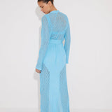 "Back view of the Chad Kaftan on a model, illustrating the harmonious blend of mesh and knit panels."
