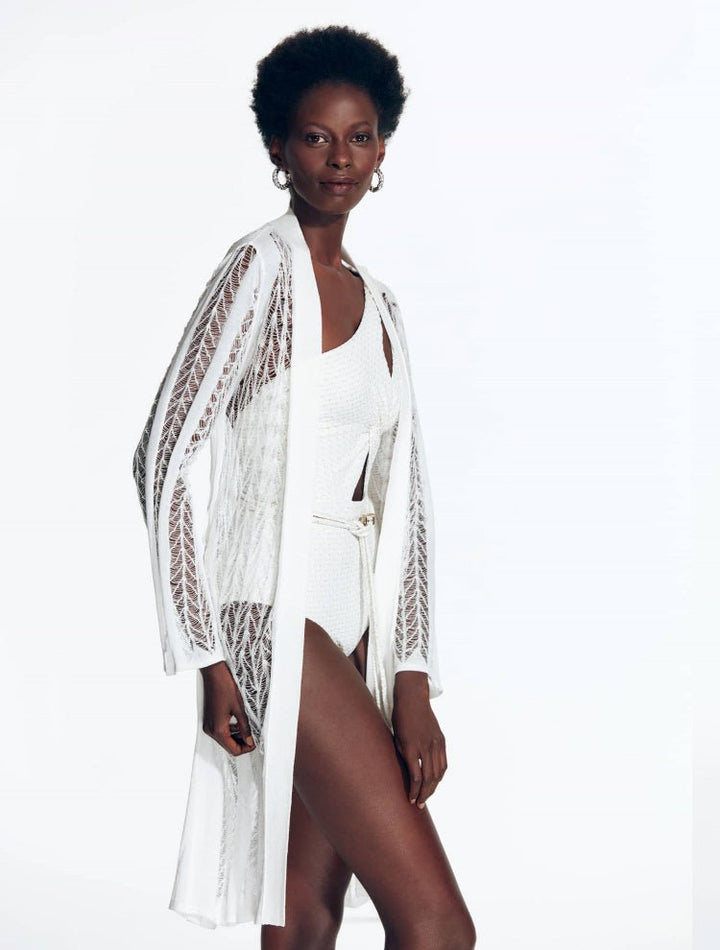 Front View: Model in Chantel White Kaftan - MOEVA Luxury Swimwear, Mesh Knit, Long-Sleeved, Knee Length, MOEVA Luxury Swimwear