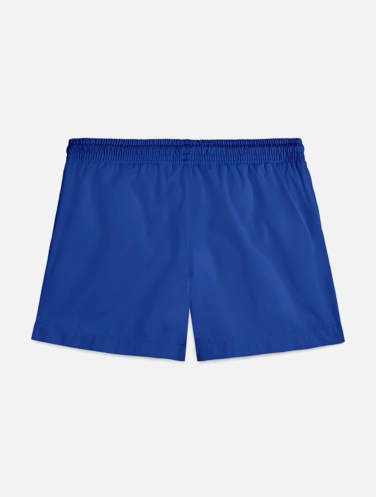 "Back of Charlie Dark Blue Kids Swim Shorts, featuring the elastic waistband and Moeva patch."