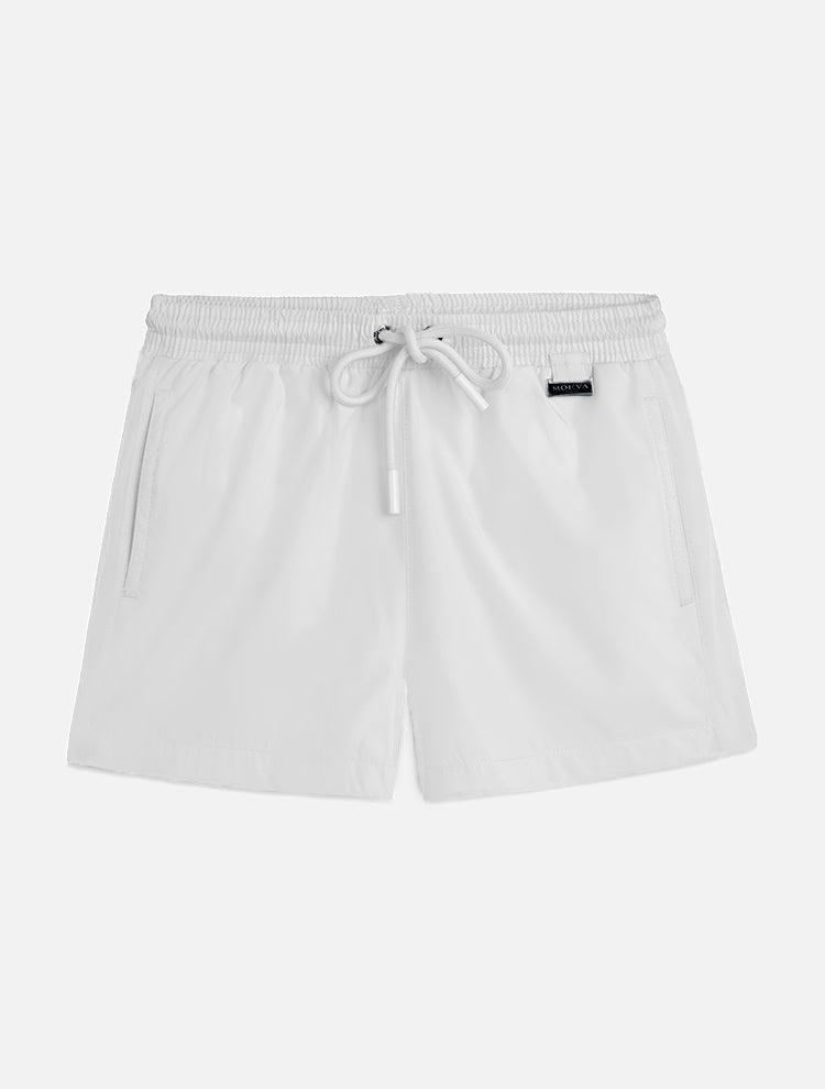 "Front view of the Charlie Kids White Shorts, showcasing the elastic waistband with adjustable drawstring and the Moeva patch."