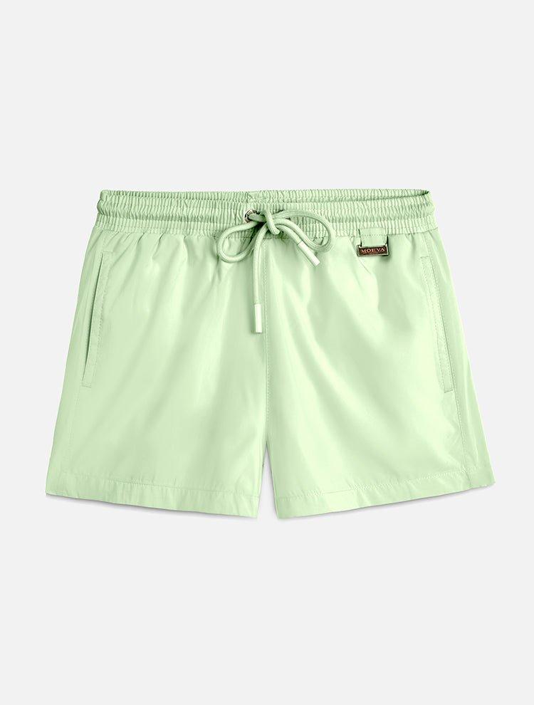 "Front view of the Charlie Mint Green Kids Swim Shorts from the front, focusing on the elastic waistband and Moeva patch."