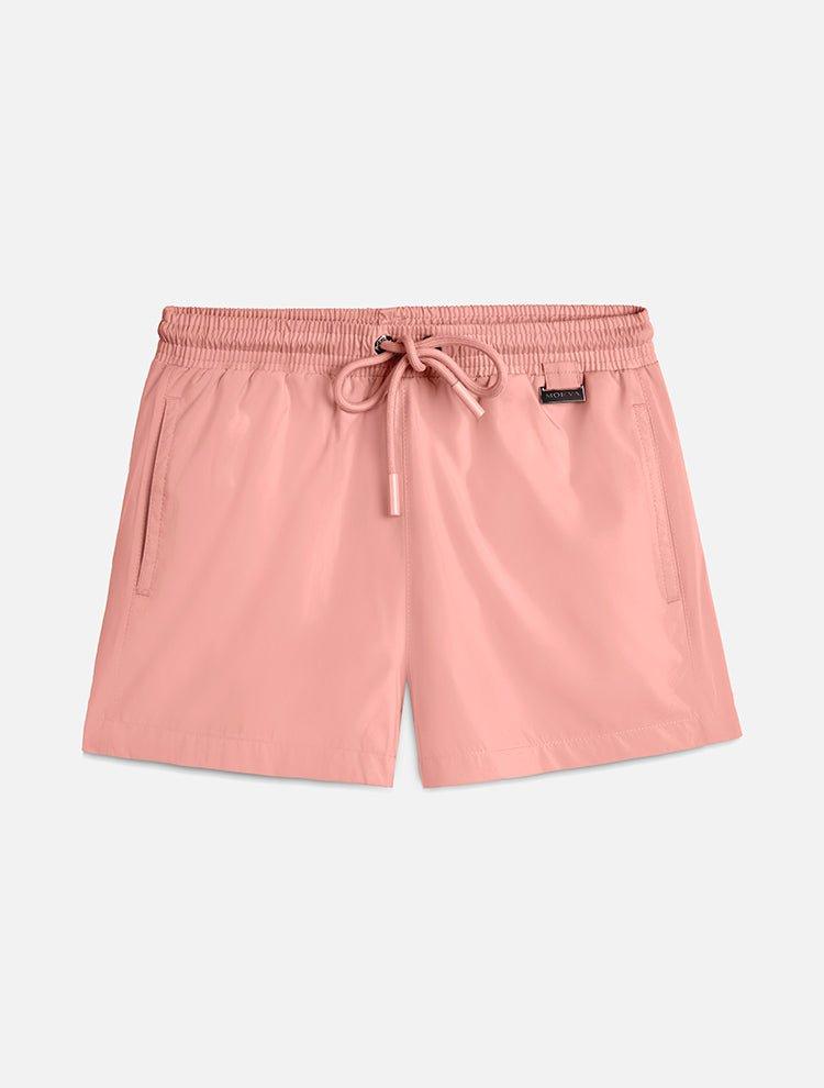 "Front view of the Charlie Old Rose Kids Swim Shorts, showcasing the elastic waistband with adjustable drawstring and the Moeva patch."