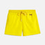 "Front view of the Charlie Yellow Kids Swim Shorts, showcasing the elastic waistband with adjustable drawstring and the Moeva patch."