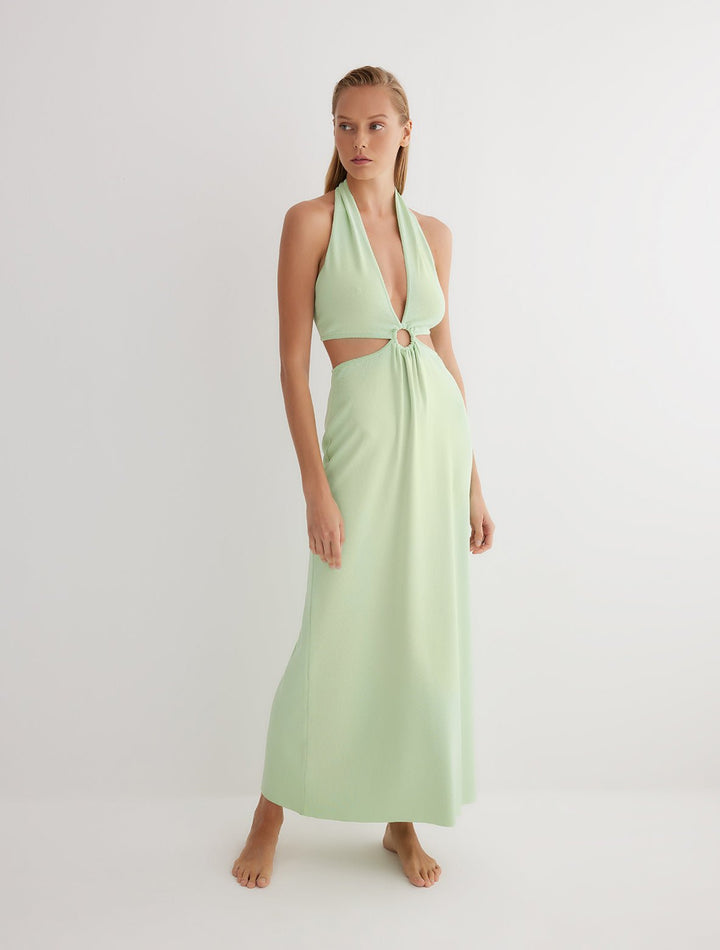 Front View: Model in Clemence Mint Green Dress - MOEVA Luxury Swimwear, Knitted Dress, Halterneck, Side Cutouts, Ring Connecting Top to the Skirt, Ankle Length, Close Fit, MOEVA Luxury Swimwear