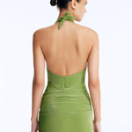 Back View: Clementine Green Swimsuit on Model - Chic Style, High-Leg Cut, Tie-Front Mini Skirt Detail, Italian Fabric, MOEVA Luxury Swimwear