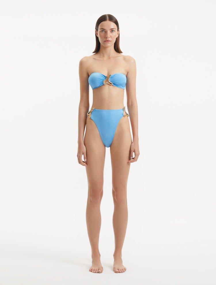 Front view of Clyde Baby Blue Bikini Bottom, showcasing high-waist design and gold accessories.