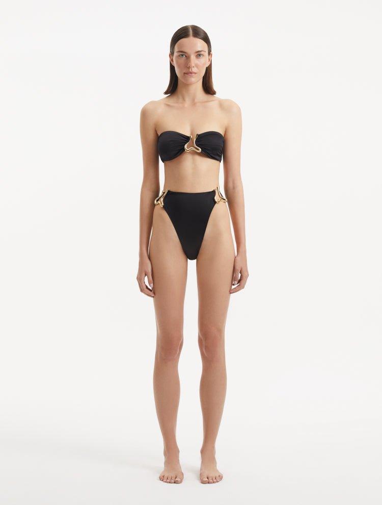  Front view of Clyde Black Bikini Bottom, highlighting high-waist design and gold accents.