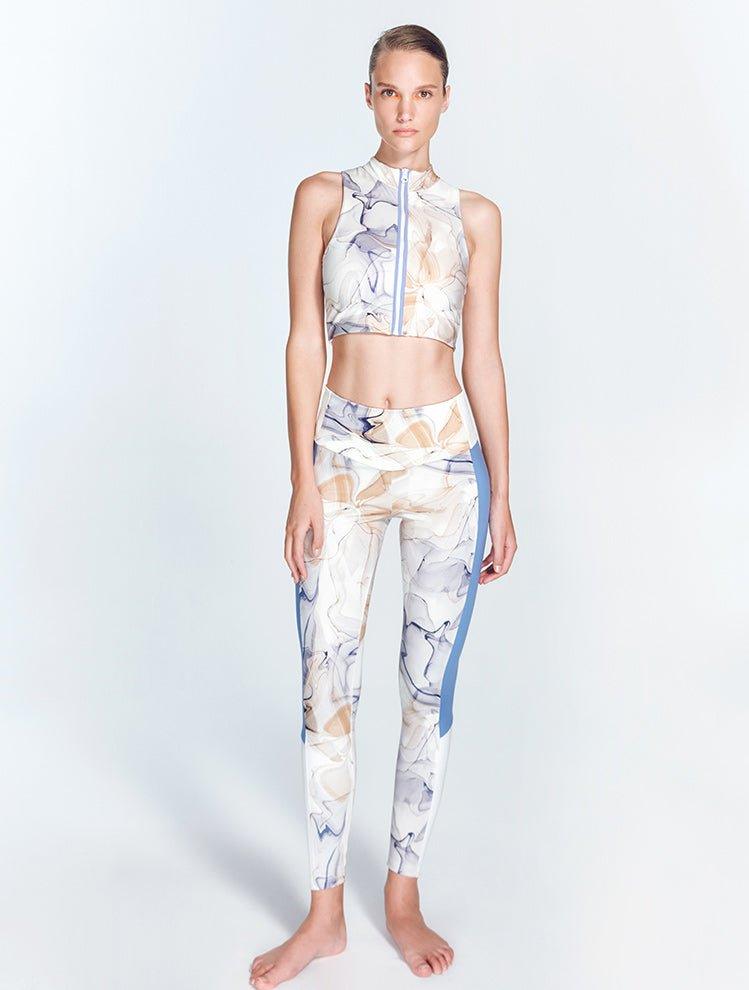 "Colombe Blue Abstract leggings front view showcasing the high-waist design with bold contrast panels. "