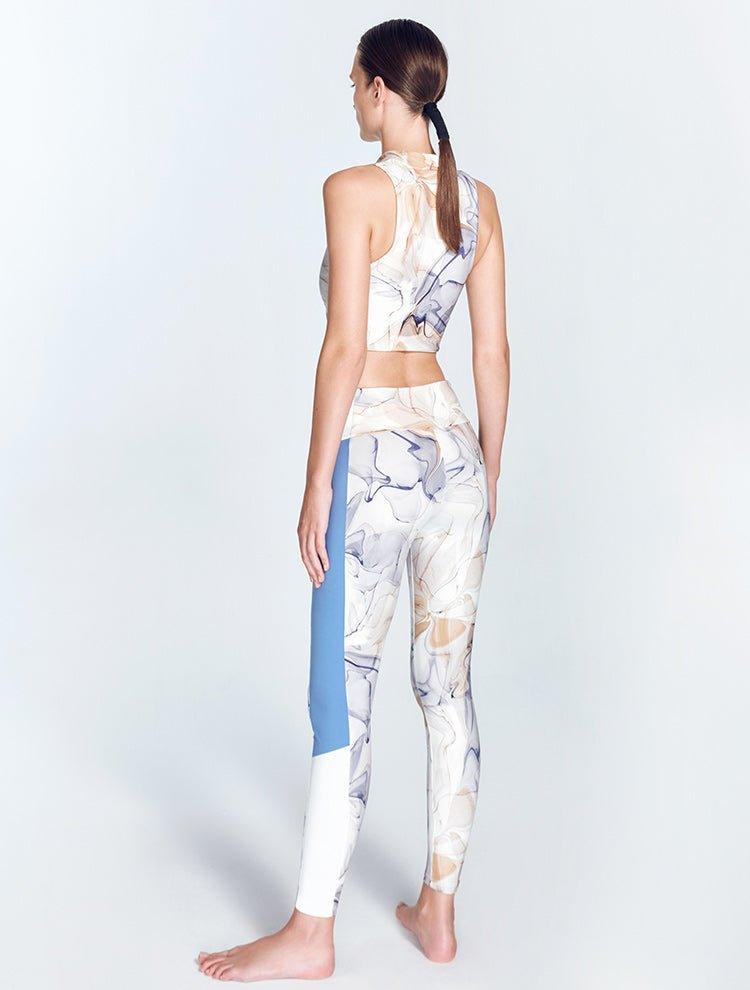 "Colombe Blue Abstract leggings back view highlighting the high-waist design and contrasting panels. "