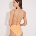 "Model wearing the Como Orange High-Waisted Bikini Set from the back, showcasing its high-leg cut, elegant topstitching details, and full bottom coverage."