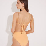 "Model wearing the Como Orange High-Waisted Bikini Set from the back, showcasing its high-leg cut, elegant topstitching details, and full bottom coverage."