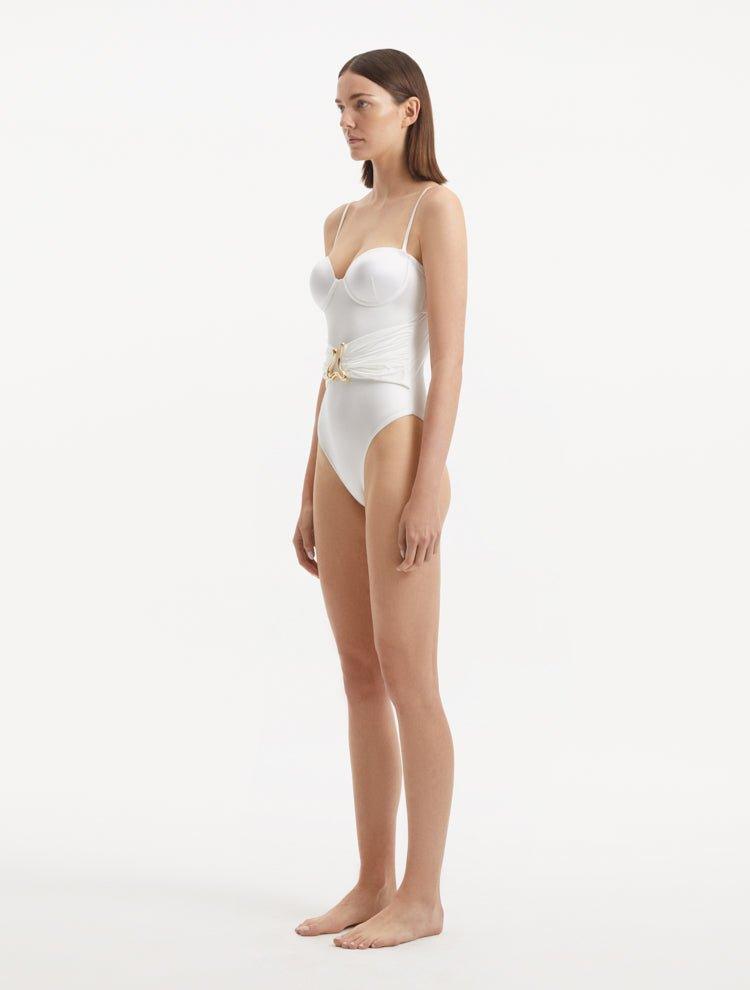 Side view of the Coral White Swimsuit, emphasizing its elegant silhouette and premium fabric.