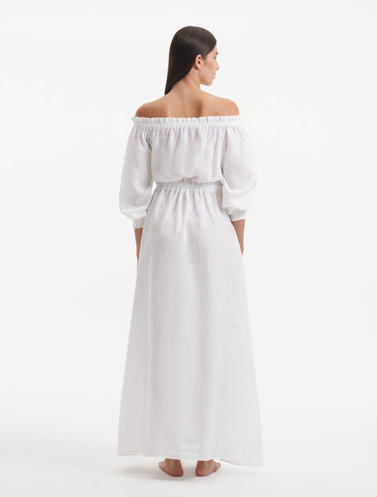 "Back view of the Dante White Dress, emphasizing the elegant flow and ankle-length cut."